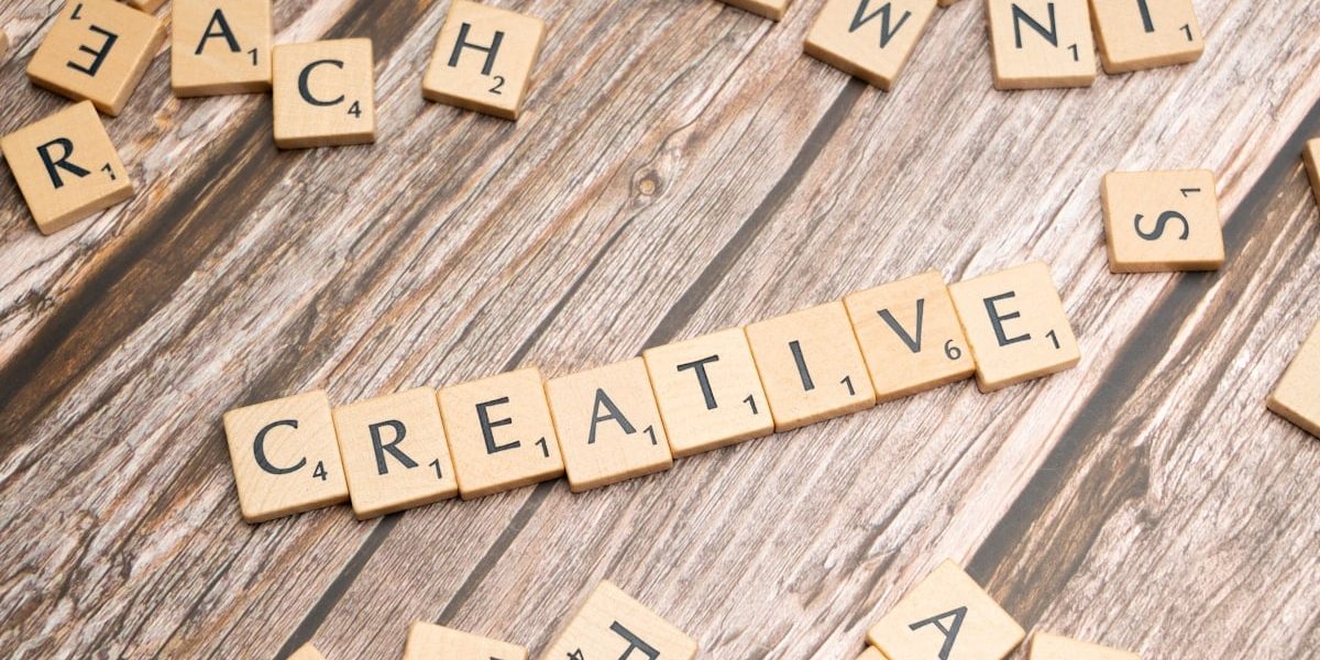 scrabble tiles spelling out the word creative