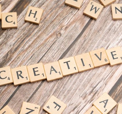 scrabble tiles spelling out the word creative