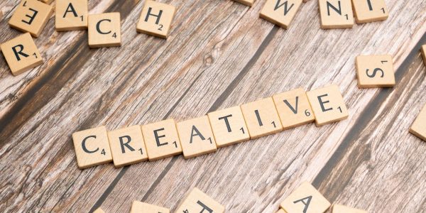scrabble tiles spelling out the word creative