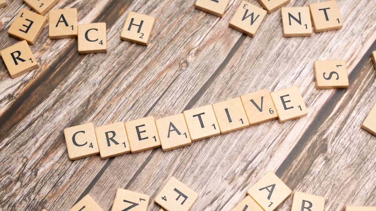 scrabble tiles spelling out the word creative